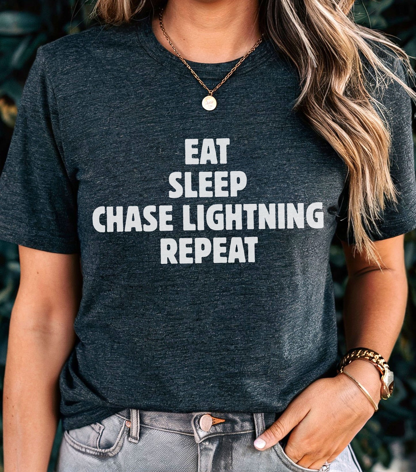 Storm Chaser T-Shirt with "Eat Sleep Chase Lightning Repeat" design, ideal for weather enthusiasts.