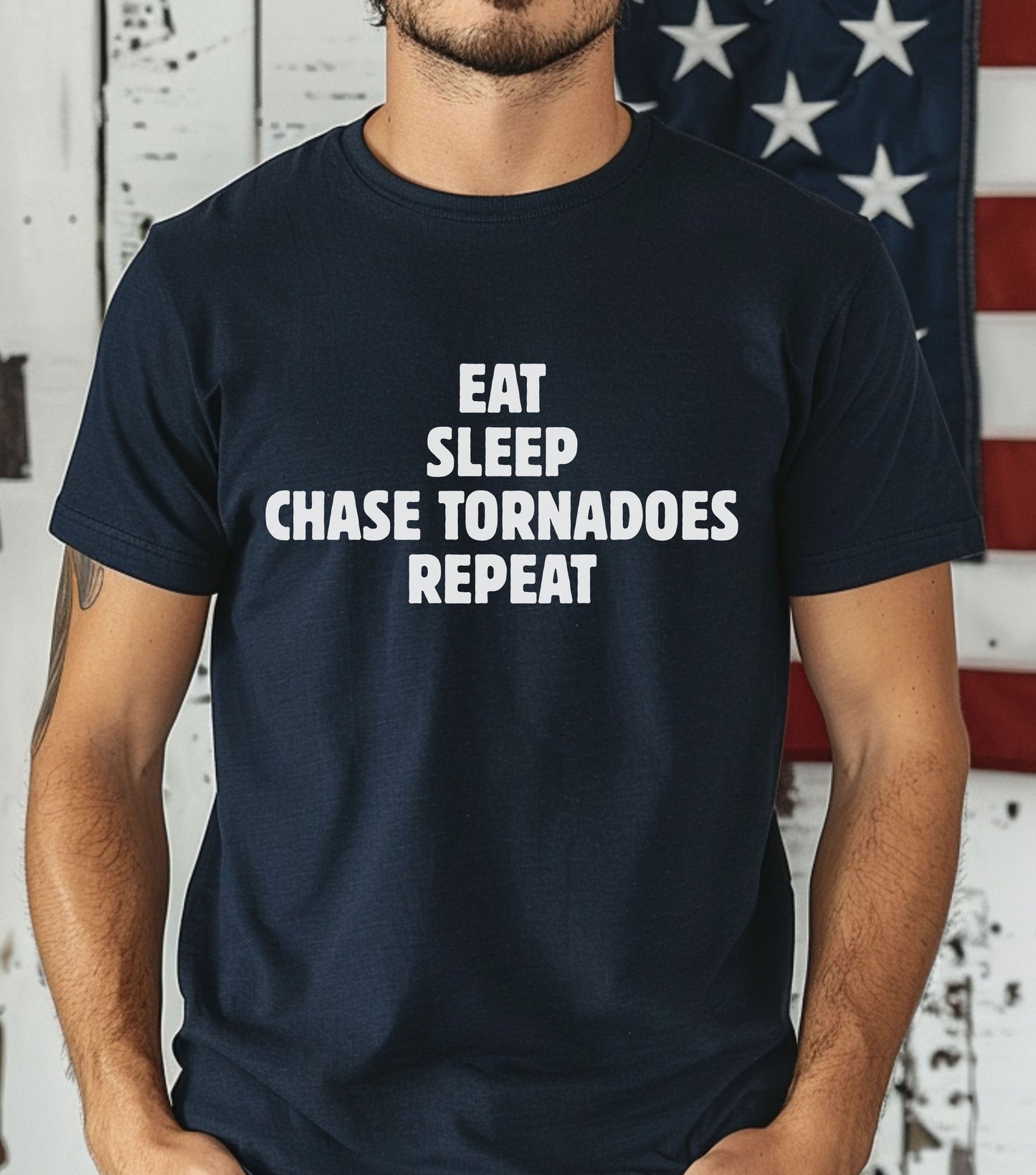 Storm Chaser T-Shirt with "Eat Sleep Chase Tornadoes Repeat" design, navy blue, ideal for weather enthusiasts and adventure seekers.