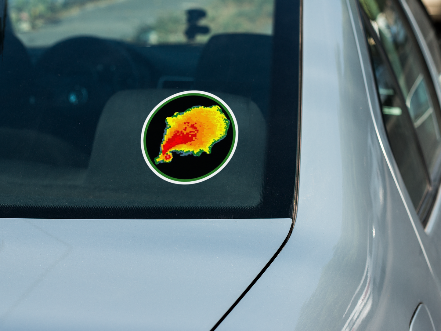 Tornado hook echo radar reflectivity sticker on car window.