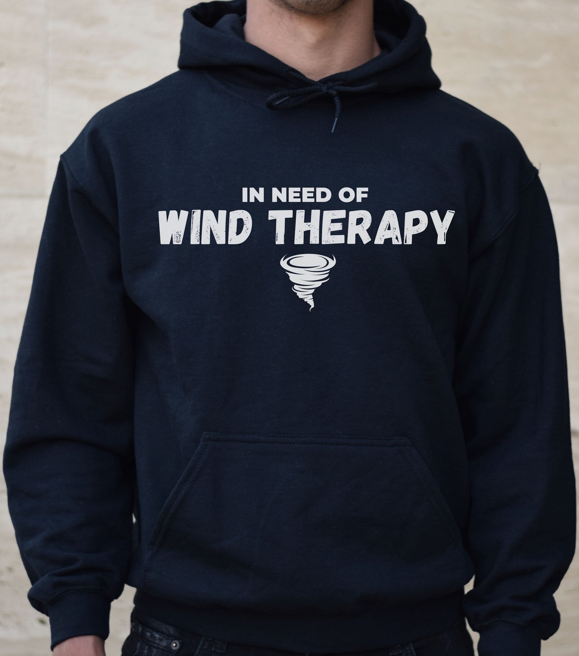 Storm Chaser Hooded Sweatshirt with "In Need of Wind Therapy" quote and tornado graphic.