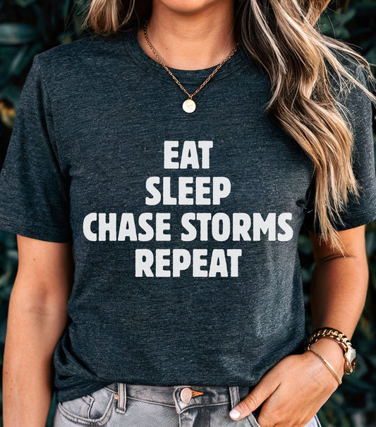 Storm Chaser T-Shirt with "Eat Sleep Chase Storms Repeat" design for weather enthusiasts.