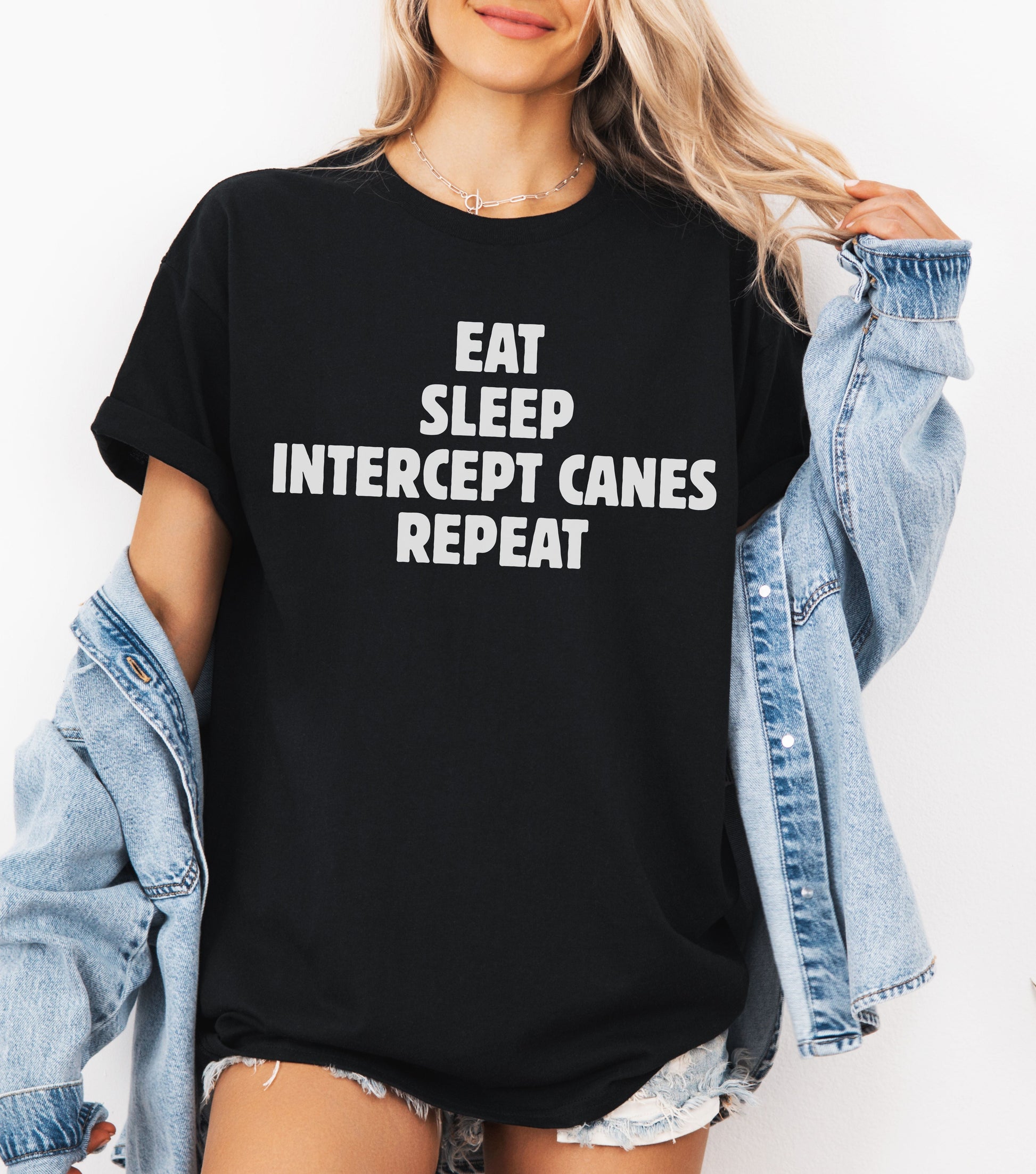 Storm Chaser T-Shirt with "Eat Sleep Intercept Canes Repeat" slogan for weather enthusiasts.