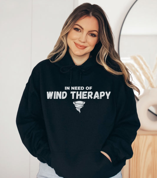 Hooded sweatshirt with "In Need of Wind Therapy" tornado design, ideal for storm enthusiasts.