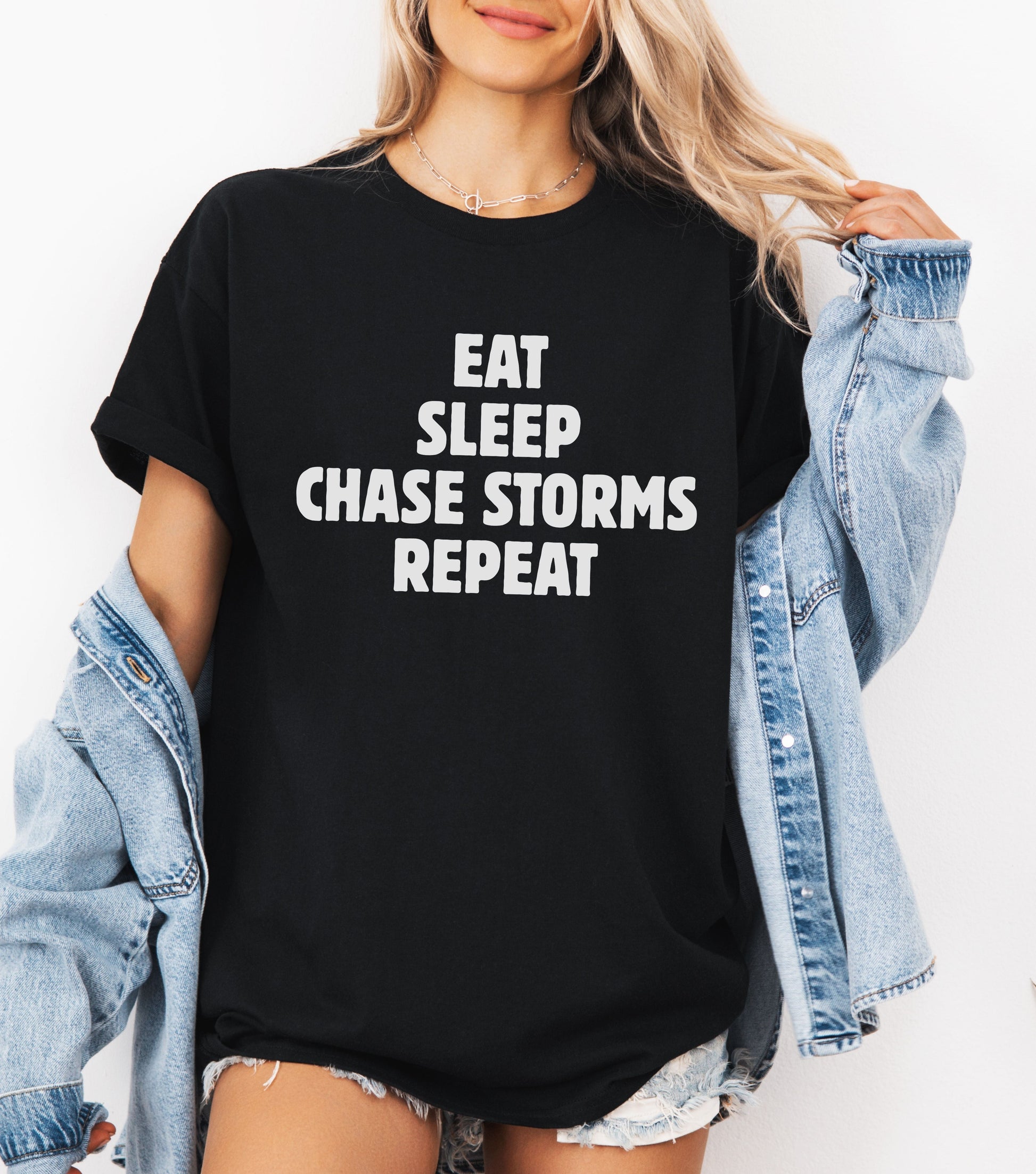 Storm Chaser T-Shirt with "Eat Sleep Chase Storms Repeat" design, ideal for weather enthusiasts.