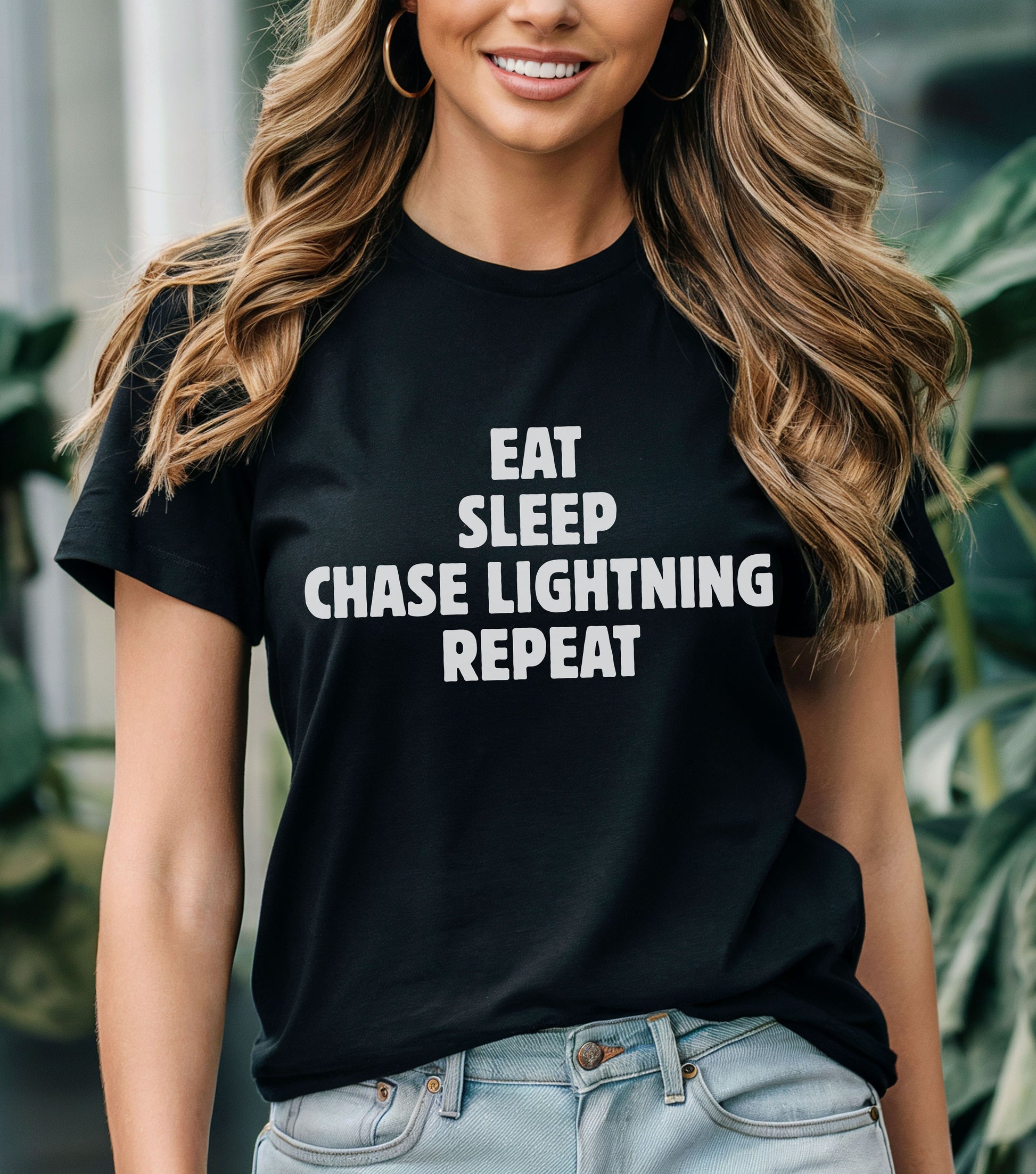 Storm Chaser T-Shirt with "Eat Sleep Chase Lightning Repeat" design.