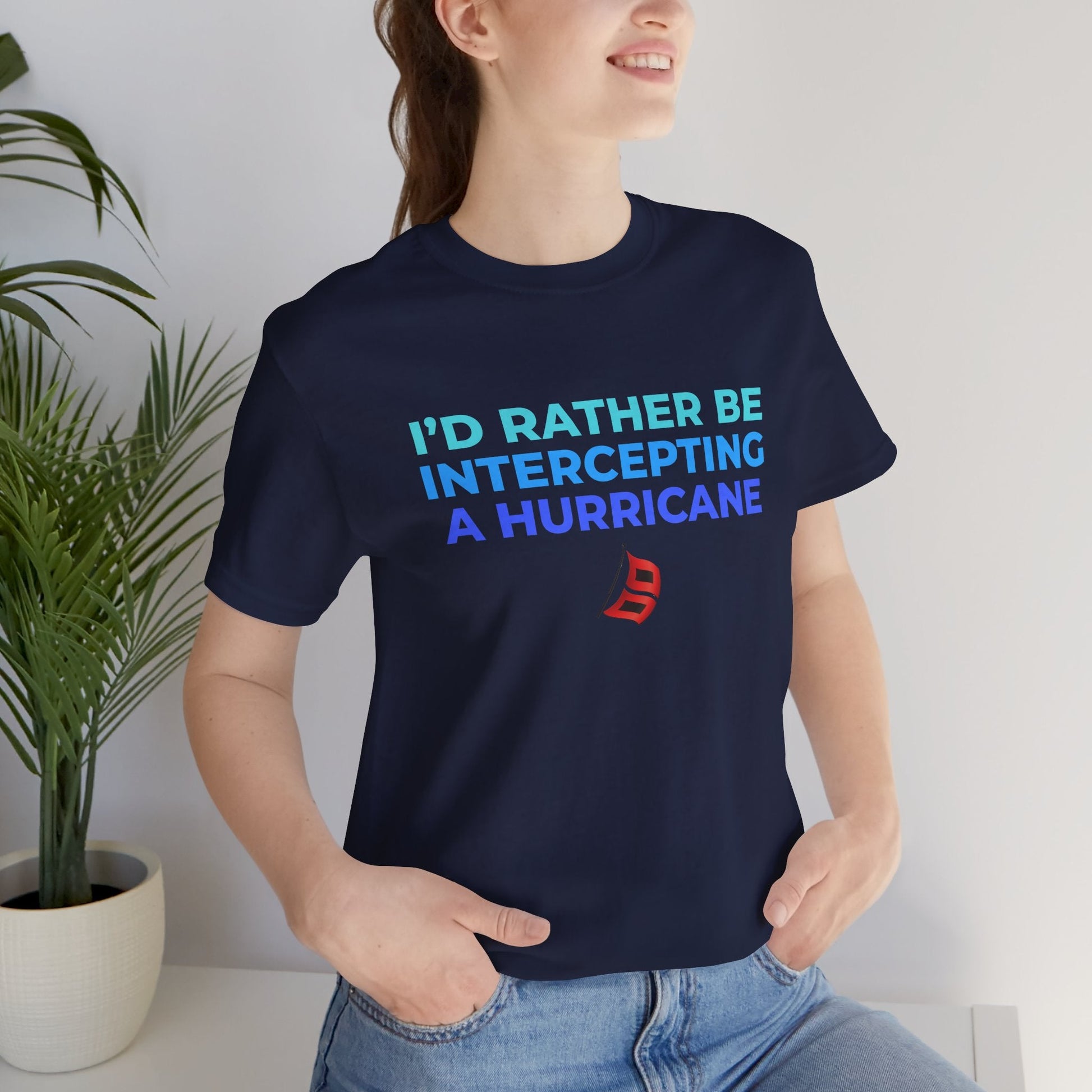 Storm Chasing T-Shirt with "I'd Rather Be Intercepting A Hurricane" quote worn by person indoors.