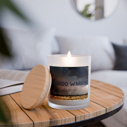 Frosted Glass Candle with Tornado Warning design on wooden table, lit for ambiance.