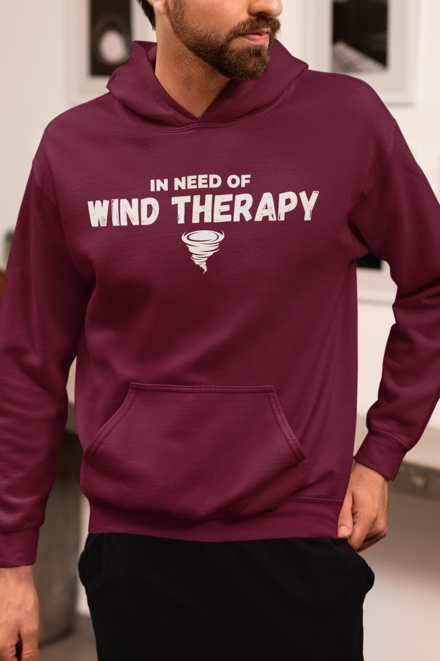 Hooded sweatshirt with "In Need of Wind Therapy" tornado design, ideal for storm chasers and weather enthusiasts.