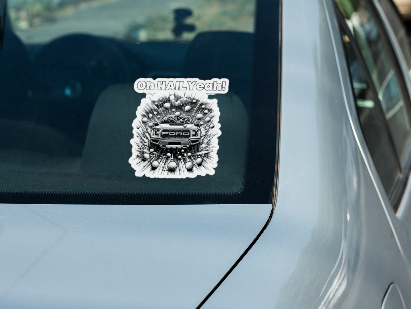Die-cut vehicle decal with "Oh HAIL Yeah" design on car window.