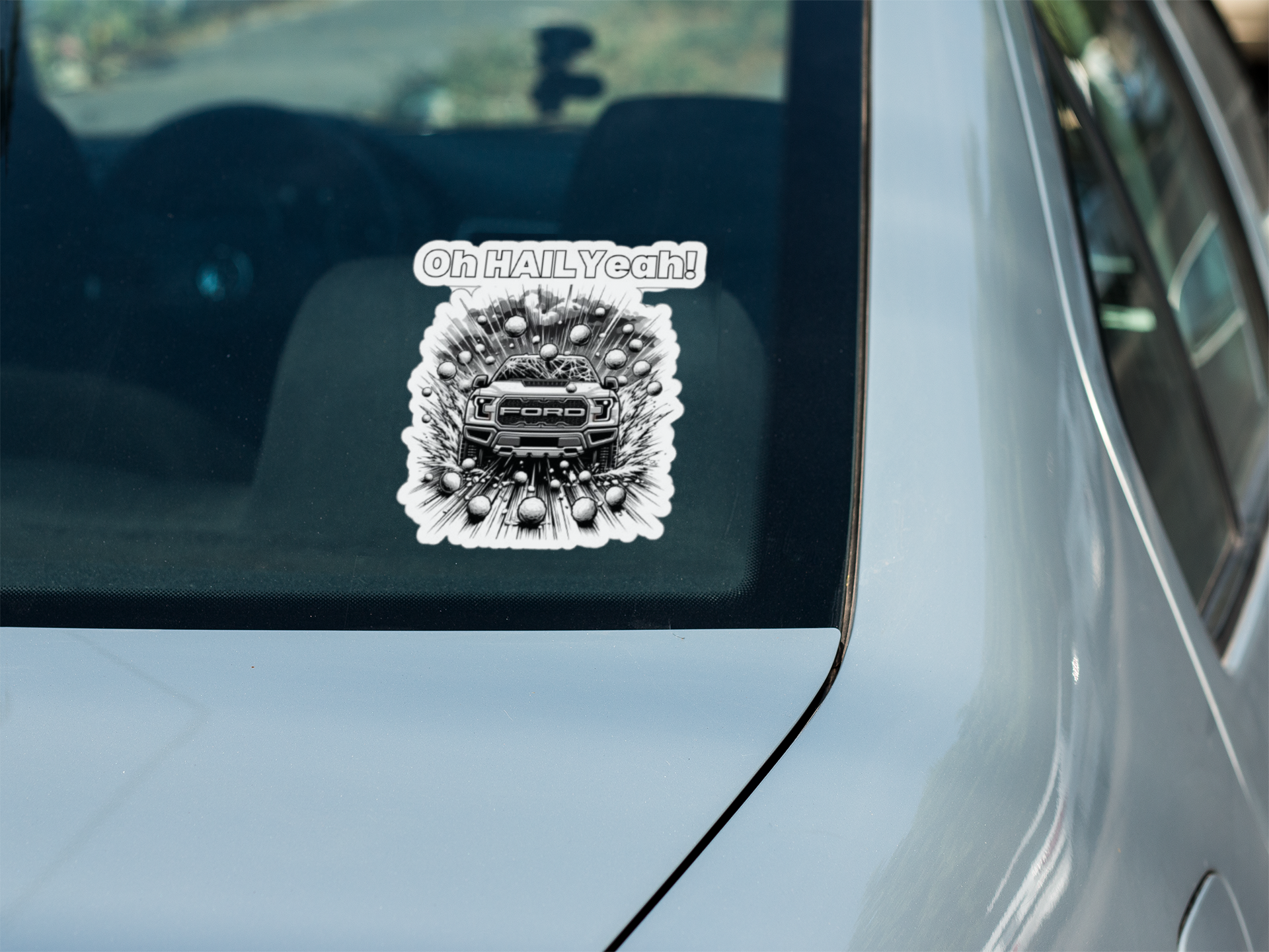 Die-cut vehicle decal with "Oh HAIL Yeah" design on car window.