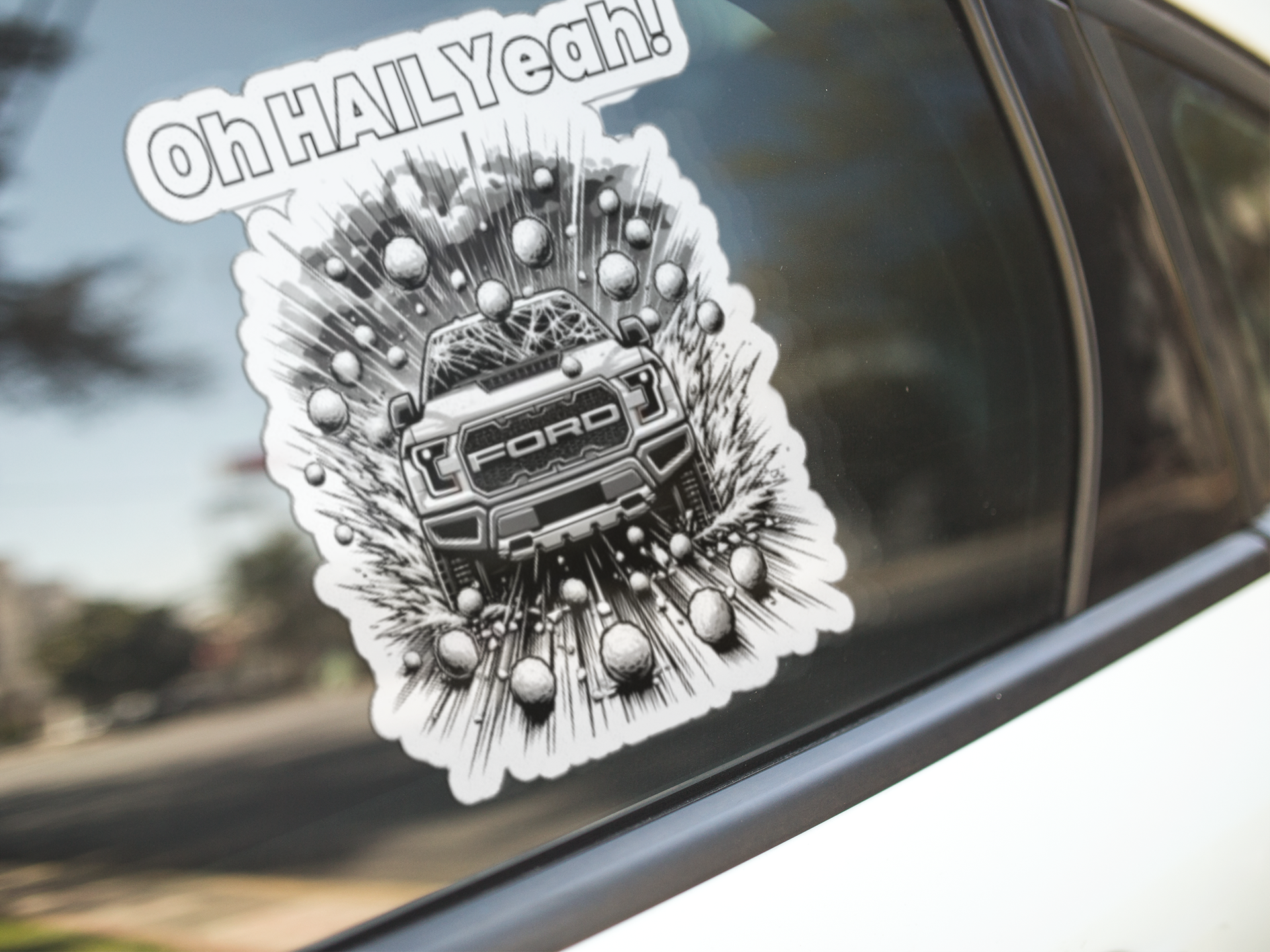 Die-cut vehicle decal with "Oh HAIL Yeah" design on window, matte finish.