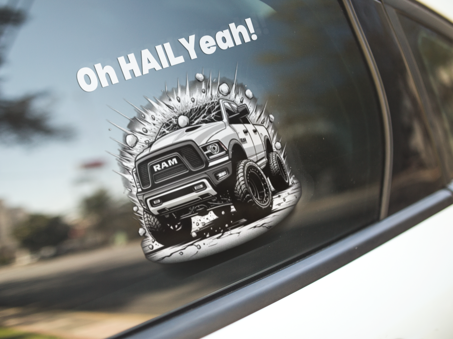 "Storm Chaser Die-Cut Sticker on vehicle window featuring 'Oh HAIL Yeah' quote and RAM truck design."